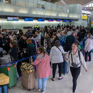 NEWARK, NEW JERSEY - MAY 05: People wait in line for a delayed flight at Newark International Airport on May 05, 2025 in Newark, New Jersey. Delays and cancellations at one of the nation's busiest airports have persisted for about a week, with these disruptions continuing into Monday morning. Air traffic control outages, runway construction, and an announcement by United Airlines that over 20% of FAA controllers at Newark walked off the job have all contributed to delays and cancellations. (Photo by Spencer Platt/Getty Images)