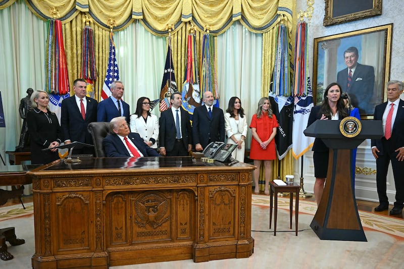 US President Donald Trump listens to US Senator from Alabama Katie Britt during an announcement in the Oval Office of the White House in Washington, DC, on October 16, 2025. (Photo by ANDREW CABALLERO-REYNOLDS / AFP) (Photo by ANDREW CABALLERO-REYNOLDS/AFP via Getty Images)