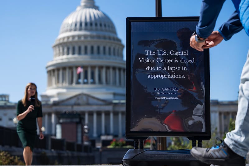 UNITED STATES - OCTOBER 1: A news crew films a segment near a sign indicating that the Capitol Visitor Center is closed due to the government shutdown, on Wednesday, October 1, 2025. (Tom Williams/CQ-Roll Call, Inc via Getty Images)