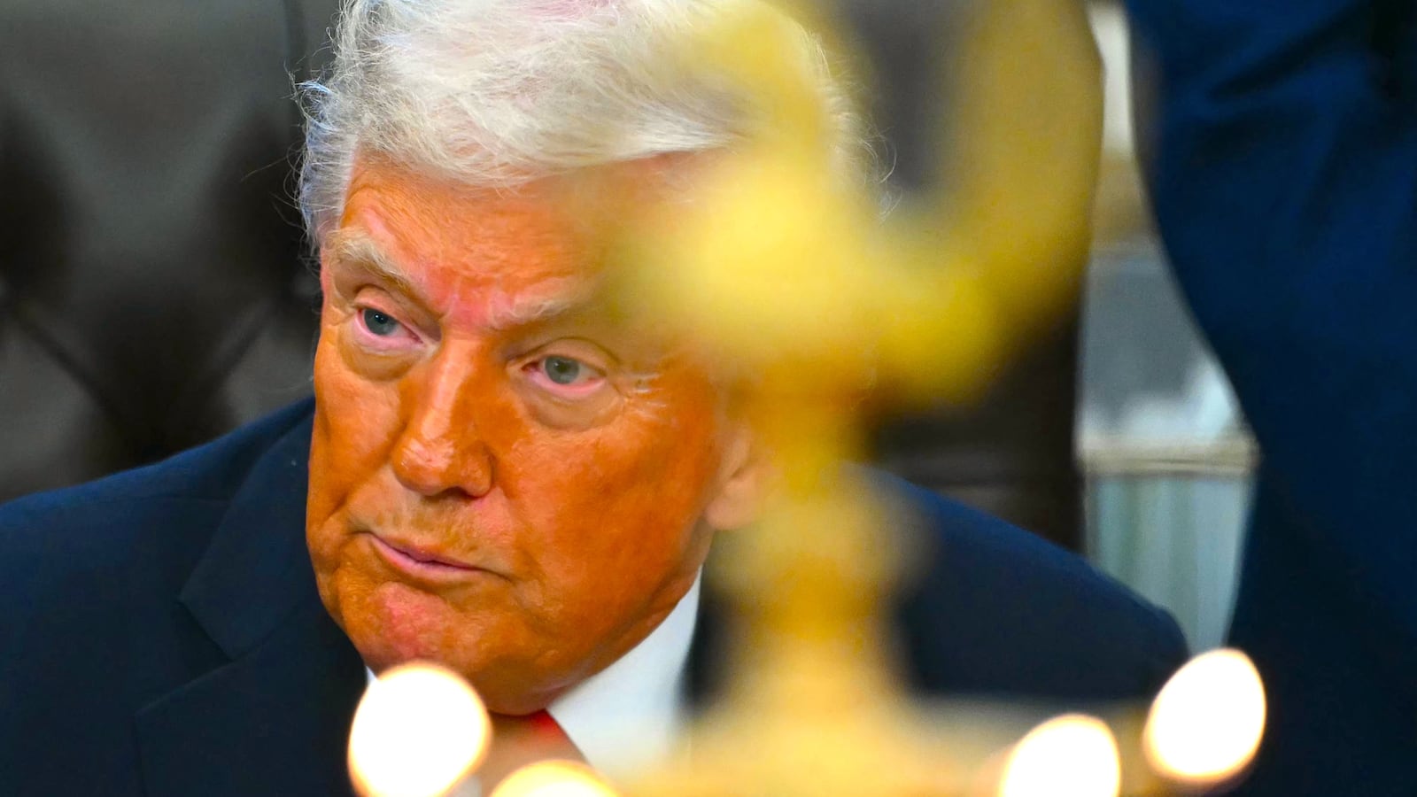 US President Donald Trump looks on as candles are lit during a Diwali celebration with American Indian leaders in the Oval Office