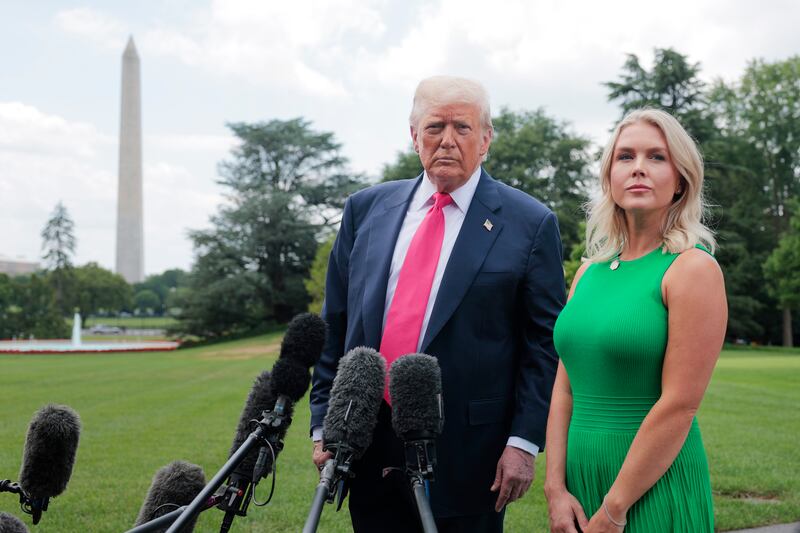 President Donald Trump, joined by White House Press Secretary Karoline Leavitt, speaks to the media as he departs the White House on July 15, 2025 in Washington, DC.