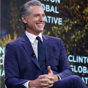 Gavin Newsom laughing and Trump's neck