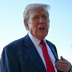 President Donald Trump speaks to reporters on the South Lawn as he departs the White House on July 25, 2025.