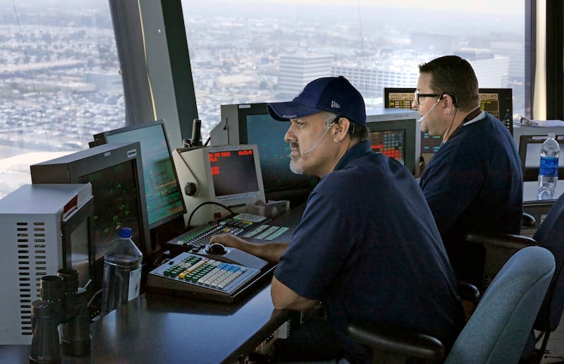 LOS ANGELES, CA - June 24: At Los Angeles International Airport FAA officials gave a media tour for a new communications system between air traffic controllers and pilots. Data Comm as it is called, is a texting system that replaces some voice radio communications that is prone to errors. It is expected to shave minutes off flights, cut down on travel delays and be more accurate. (Photo by Brad Graverson/MediaNews Group/Torrance Daily Breeze via Getty Images)