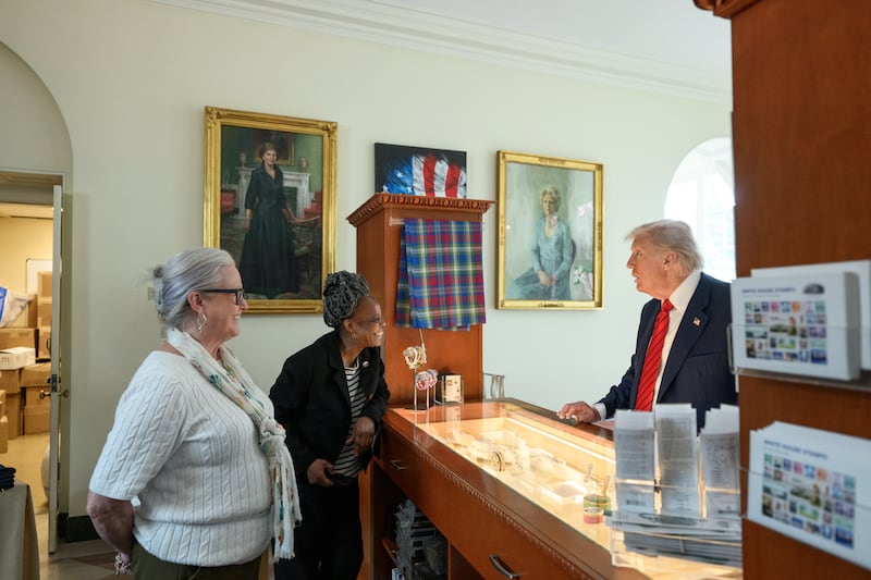 President Donald Trump visits the gift shop in the East Wing of the White House, Tuesday, August 5, 2025.