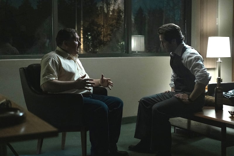 Michael Chernus as John Wayne Gacy and Michael Angarano as Sam Amirante.