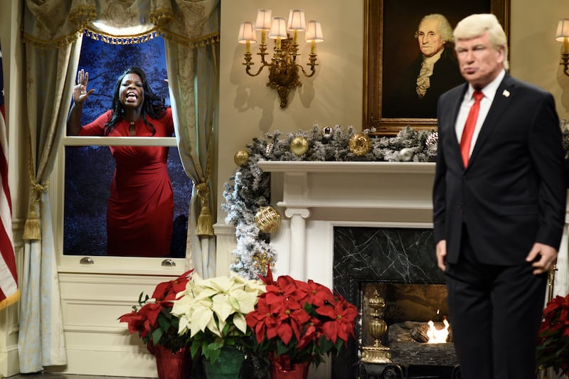 SATURDAY NIGHT LIVE -- Episode 1734 -- Pictured: (l-r) Leslie Jones as Omarosa Manigault, Alec Baldwin as President Donald J. Trump during "White House Tree Trimming Cold Open" in Studio 8H on Saturday, December 16, 2017 -- (Photo by: Will Heath/NBCU Photo Bank/NBCUniversal via Getty Images via Getty Images)
