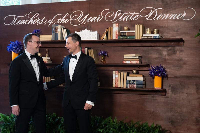 Former U.S. Secretary of Transportation Pete Buttigieg and his husband, Chasten Buttigieg, arrive in the East Wing of the White House for a "Teachers of the Year" State Dinner in 2024.