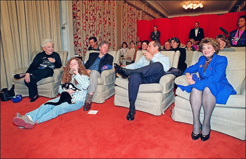 US President Bill Clinton (4th-l) in file picture taken 31 January 1993 at the White House, Washington, DC., chats with New York Governor Mario Cuomo (2nd-r) as Texas Governor Ann Richards (l) and Clinton's daughter Chelsea (holding the White House cat Socks) watch Super Bowl XXVII on TV.