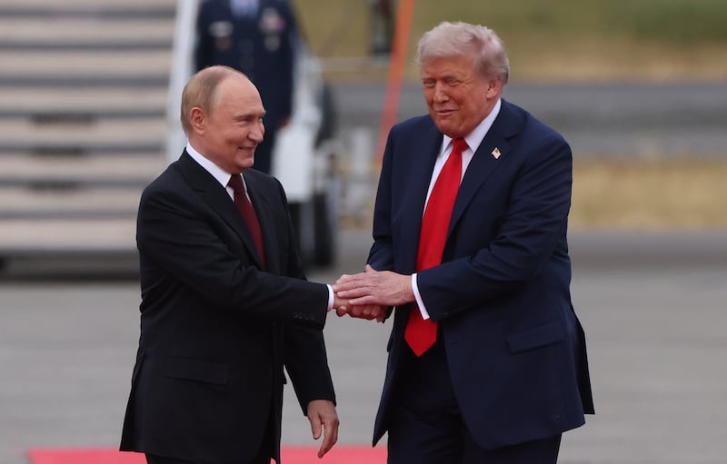 U.S. President Donald Trump welcomes Russian President Vladimir Putin to Joint Base Elmendorf-Richardson