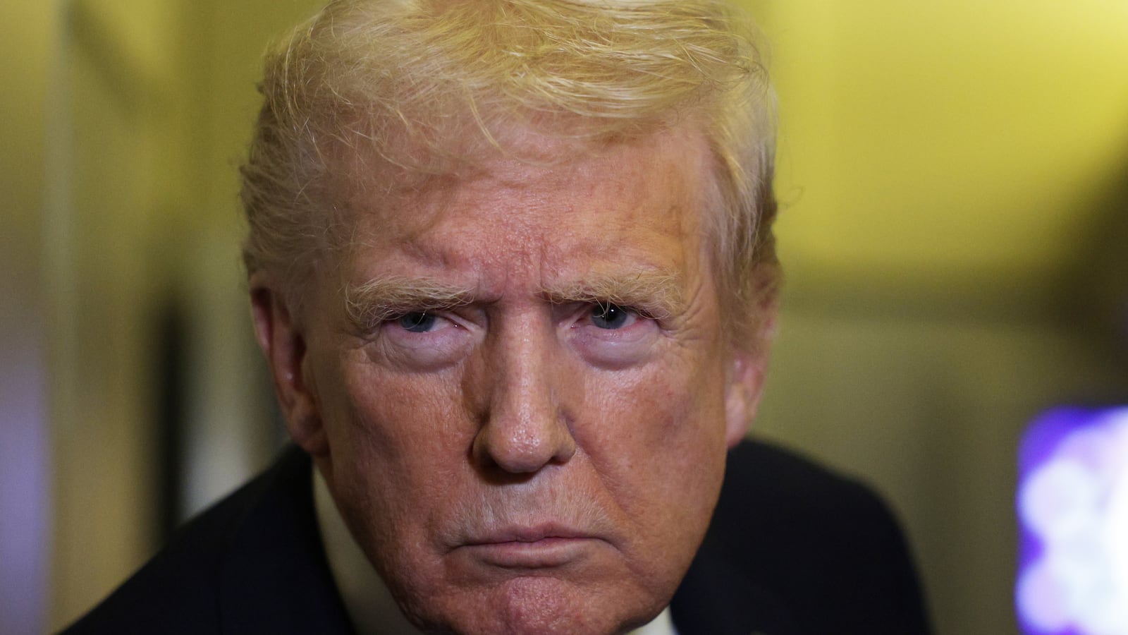 IN FLIGHT - OCTOBER 19: U.S. President Donald Trump speaks to members of the press on October 19, 2025 aboard Air Force One. The President is returning to Washington, DC, after spending his weekend at Mar-a-Lago resort in Palm Beach, Florida. (Photo by Alex Wong/Getty Images)