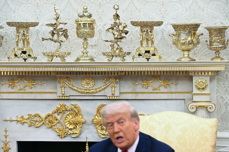 Gold colored ornaments and decor are seen as US President Donald Trump speaks during a meeting with Turkey's President Recep Tayyip Erdogan in the Oval Office of the White House in Washington, DC on September 25, 2025. (Photo by SAUL LOEB / AFP) (Photo by SAUL LOEB/AFP via Getty Images)